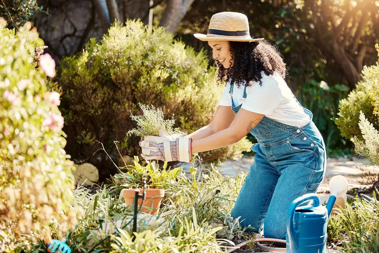 Woman tending to lawn outdoors