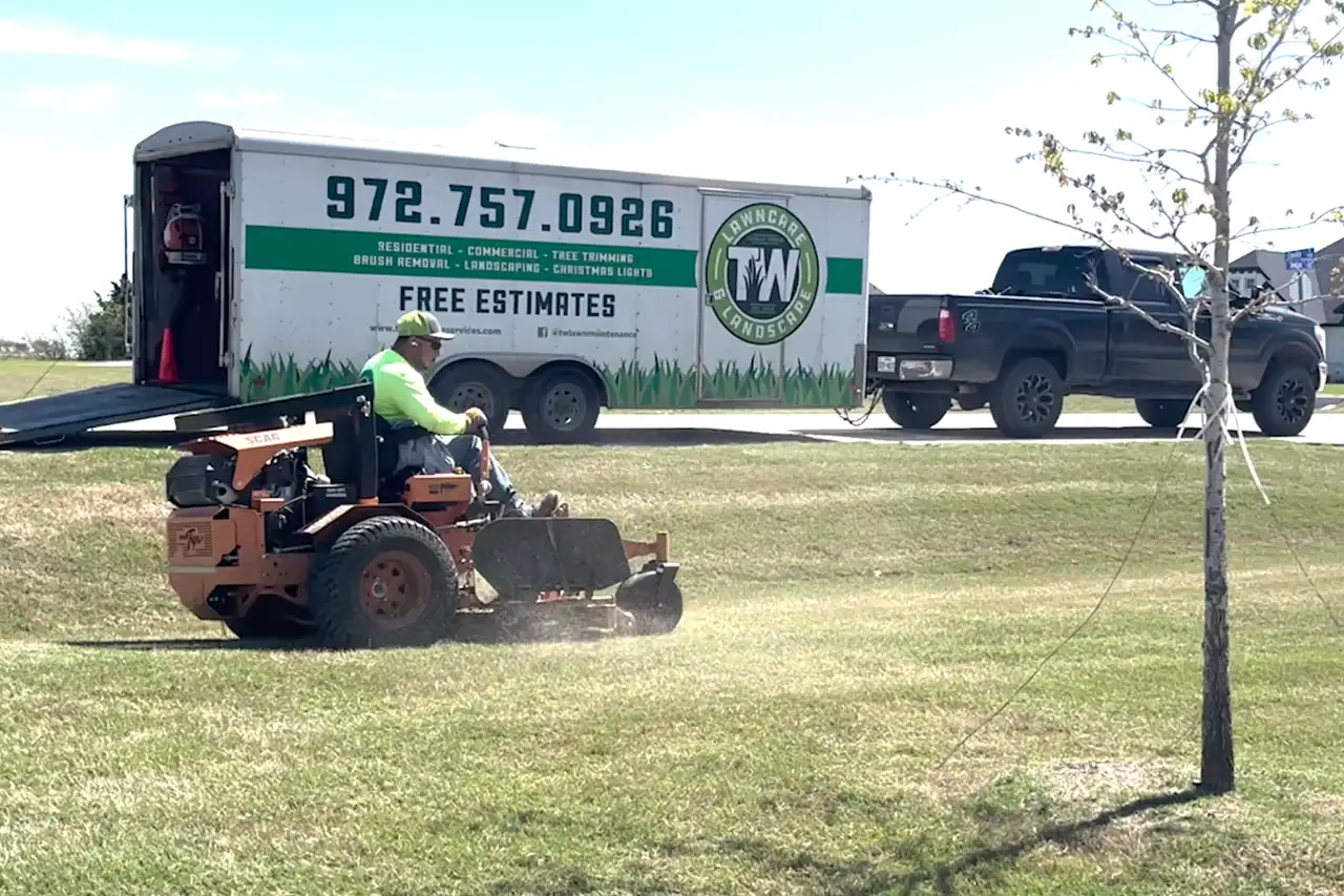 TW Lawn Care mowing a Bermuda lawn in Midlothian TX
